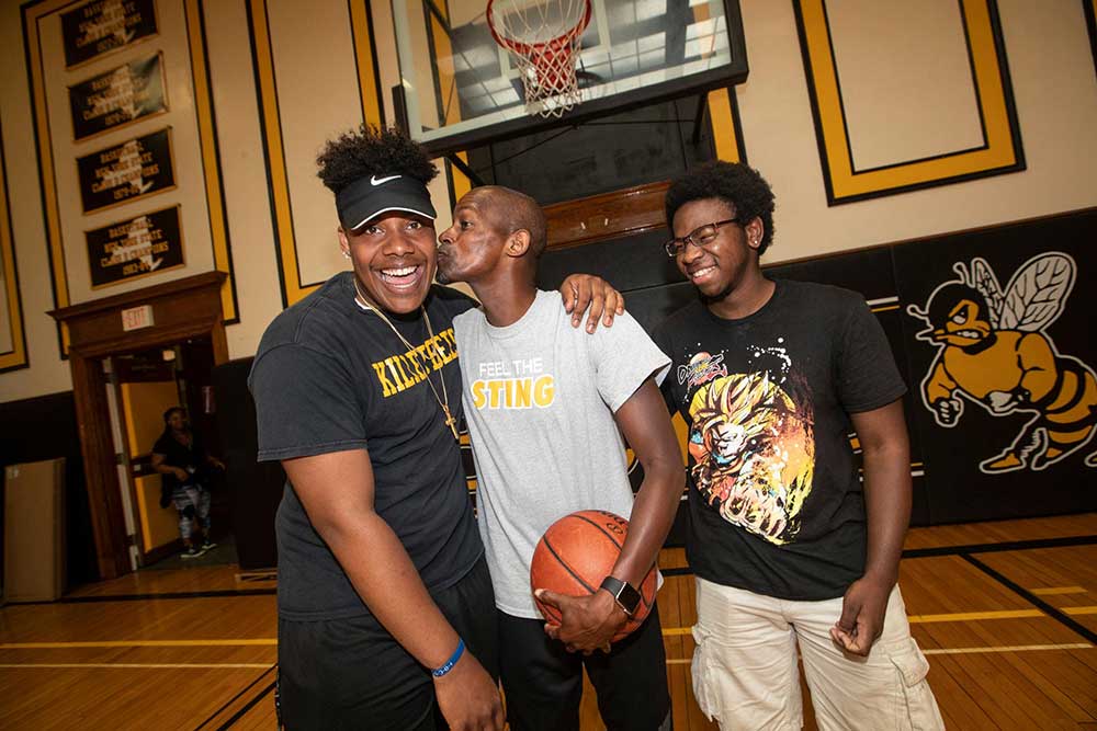 Elijah Jackson, 20, coach Carl Johnson, Jamari Gant, 20 all from Bridgehampton stand inside the gym at the Bridgehampton School in Bridgehampton on Friday, July 20, 2018.